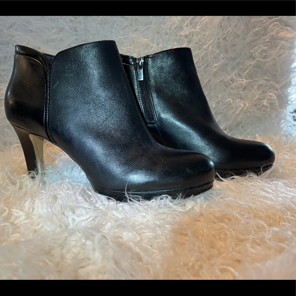 New without box black small platform ankle booties. Never worn. Clarks.